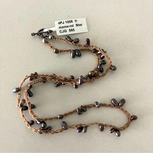 One of a kind freshwater chocolate pearls crocheted into a necklace 16” long.